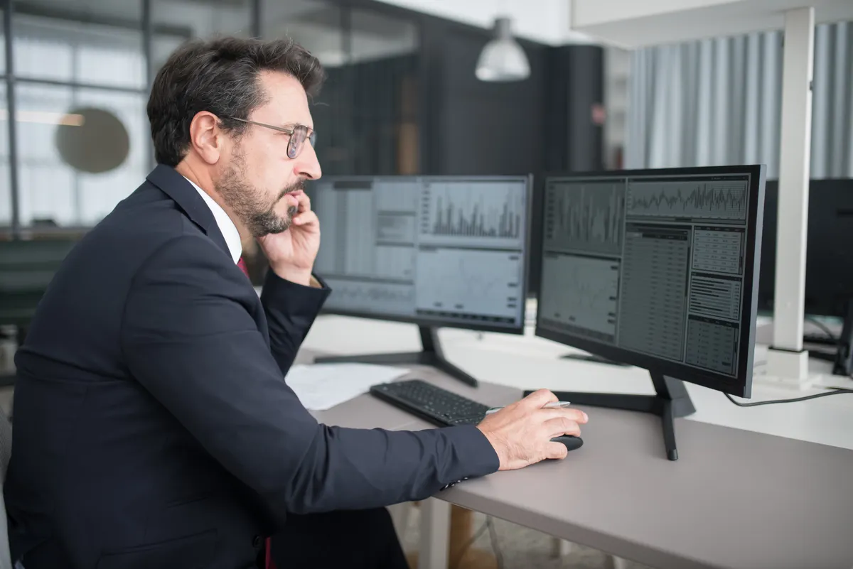 Comparing two job application automation tools side by side on a laptop