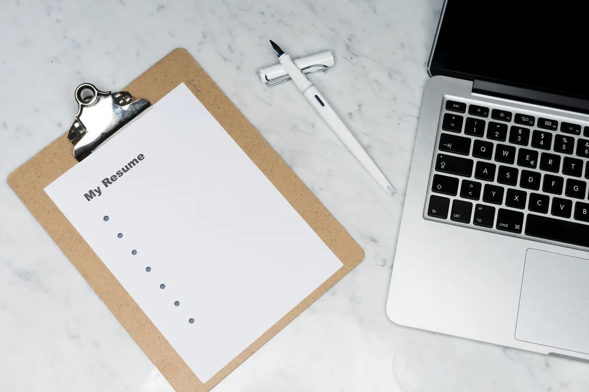 Adding the right ATS keywords to a resume on a laptop