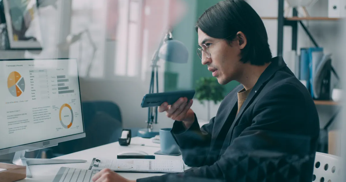 A professional updating their LinkedIn profile on a laptop