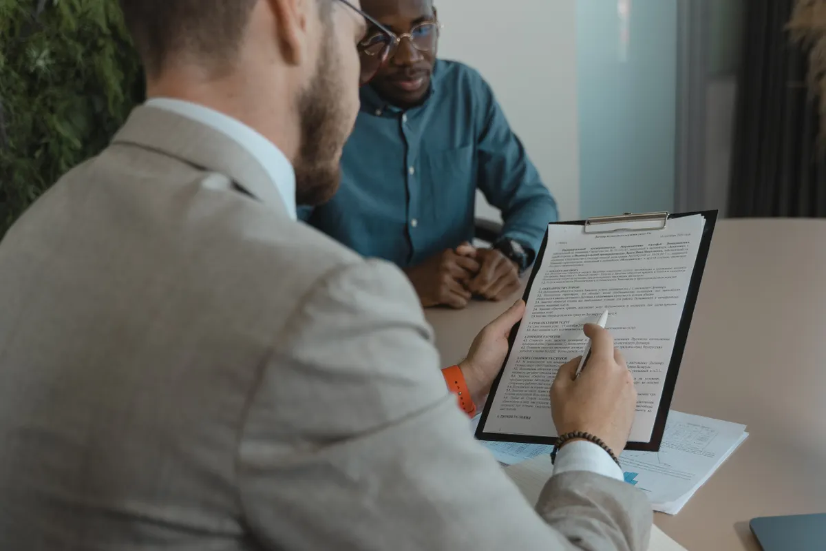 Reviewing a resume against a good ATS score in an office